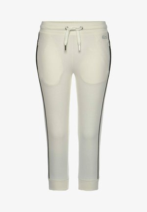 Helle beige Jogginghose mit elastischem Bund und Kordelzug. Sie verfügt über seitliche Taschen mit kontrastierenden schwarzen Streifen entlang der Nähte.