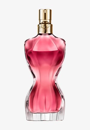 Curved pink perfume bottle shaped like a female torso with a gold spray nozzle and ring detail on top.