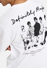 White cotton t-shirt featuring a black graphic print of six figures on the back, with the text "Definitely Maybe" above.