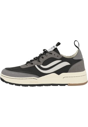 Low-top sneaker in black and gray with white wave design, black laces, pull tabs, and cream-colored sole with textured tread.