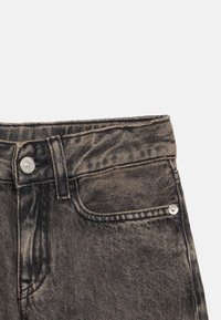 Black denim jeans with a faded texture, featuring a standard button closure, five-pocket design, and contrasting stitching details.