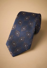 Navy blue tie featuring a diagonal ribbed texture with contrasting diamond patterns, in brown and silver, with a smooth finish.