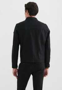 Pierre Cardin Jacka i konstläder - schwarz