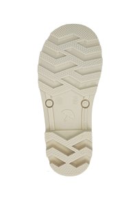 Semelle de chaussure en caoutchouc blanc avec un motif de semelle en zigzag, des grips circulaires et deux accents circulaires en relief. Les marquages incluent "Fabriqué en Lituanie."