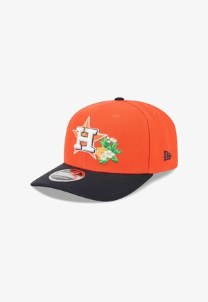 Orange and black baseball cap with white "H" over a star and floral embroidery on front, New Era logo on side, and sticker on black brim.