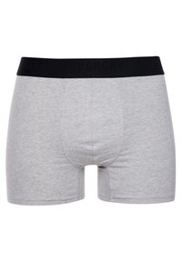 Boxer shorts en coton gris clair avec une taille élastique noire arborant le logo "SUPERDRY". Design simple avec une coupe ajustée et sans motifs.
