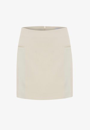 Beige mini skirt with a smooth fabric, featuring side pockets and a concealed zipper at the back. Textured side panels add detail.