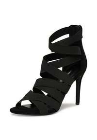 Mustad musta värvi kõrge kontsaga sandaalid, millel on ristkasutatavad elastsed rihmad, avatud varvas ja pehme sametitaoline viimistlus. Omab õhukest stiletto-kontsa.