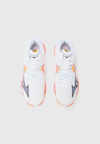 White athletic shoes with a breathable mesh upper, black and orange accents, and a padded collar; rubber sole with contrasting colors.