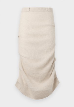 Béžová sukňa po kolená z mäkkej látky, s nariasenými detailmi a hladkou textúrou. Elastický pás pre priliehavý vzhľad.