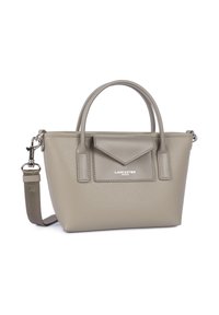 Small beige textured leather handbag with two handles, a front flap pocket, and a detachable shoulder strap with metal clasps.