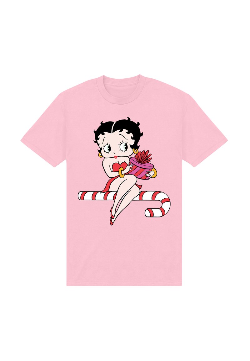Růžové tričko s kreslenou postavičkou s černými kudrnatými vlasy, která drží dárek a sedí na pruhované cukrové holi.
