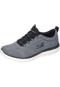 Grå atletisk sko med ett ventilerande stickat ovandel, svarta snören och en vit sula märkt "lite-weight". Har en logotyp på sidan.