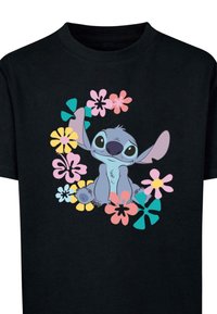 Schwarzes Baumwoll-T-Shirt mit einem Cartoon-Charakter, der von bunten Blumen umgeben ist, mit blauen, rosa, gelben und grünen Akzenten.