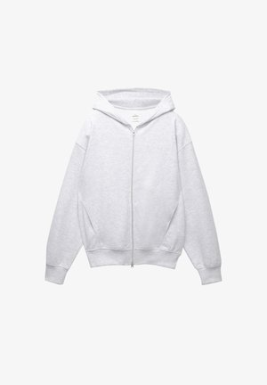 Felpa con zip grigia chiara e cappuccio regolabile, vestibilità ampia, ampie tasche laterali e polsini e orlo a coste, realizzata in tessuto morbido.