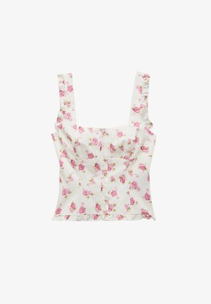 Top court sans manches blanc avec un imprimé floral de roses roses, devant à boutons, décolleté carré, bretelles à volants et détail d'ourlet.