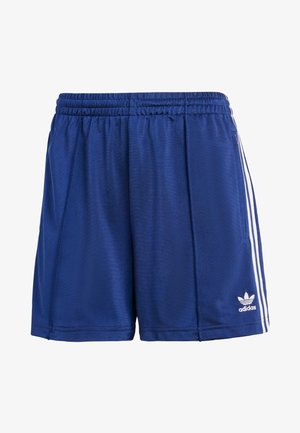 Zilas sporta šortus, kas izgatavoti no gludas auduma, ar elastīgu jostu, baltām sānu svītrām un mazu logotipu apakšējā malā.