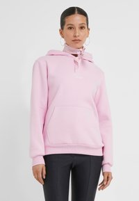 Hoodie rose en mélange de coton, avec une poche avant, un texte brodé "Babe" et un cordon ajustable à la capuche.