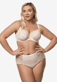Bielizna koronkowa w kolorze kremowym, składająca się z biustonosza i majtek, ozdobiona wzorami kwiatowymi, z regulowanymi ramiączkami oraz dekoracyjną kokardką na biustonoszu. Miękka i elegancka faktura.
