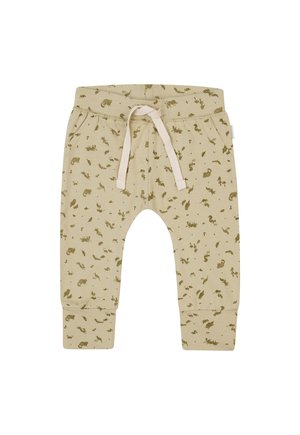 Beige Kinder-Sweatpants mit olivgrünen Tier- und Pflanzenprints. Elastischer Bund mit Kordelzug, gerippten Bündchen und Seitentaschen.