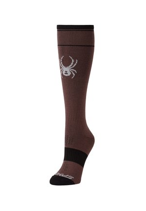 Chaussette marron jusqu'au genou avec bout et bord-côte noirs, présentant un motif blanc d’araignée sur le côté et une bande côtelée noire de soutien de la voûte plantaire.