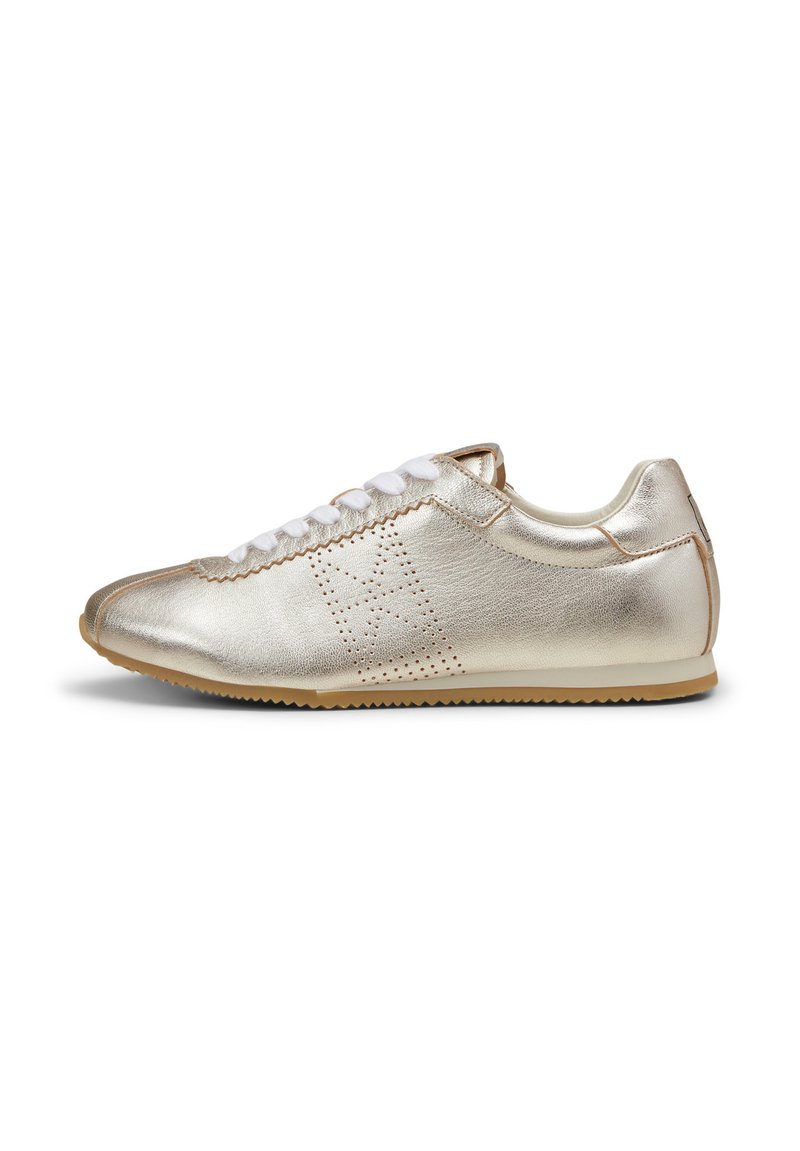 Metallic gold leather sneaker with white laces, rounded toe, textured side panel, and a rubber sole. Features perforated detailing.