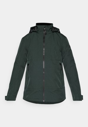 Sötétzöld dzseki sima anyagból, magas gallérral, elöl cipzáras záródással és két oldalsó cipzáras zsebbel. Hosszú ujjak ribbelt mandzsettával.