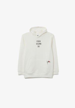 White hoodie featuring a front pocket, drawstring hood, and printed text "I NEED VITAMIN SKI." Small graphic detail at the hem.