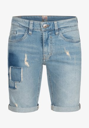 Light blue denim shorts with a frayed hem, distressed details, and a large patch on the left thigh. Standard front pockets included.