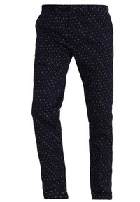 Granatowe spodnie slim fit w małe białe kropki, z zapięciem na guzik z przodu, kieszeniami bocznymi i paskiem.