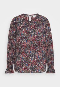 Långärmad blus i mörkt tyg med ett blommönster i rött, blått och krämfärgat, med ett nyckelhålsringning och utsvängda manschetter.