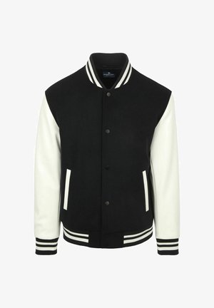 Black and white varsity jacket with snap buttons, white sleeves, striped collar, cuffs, and hem, and two vertical front pockets.