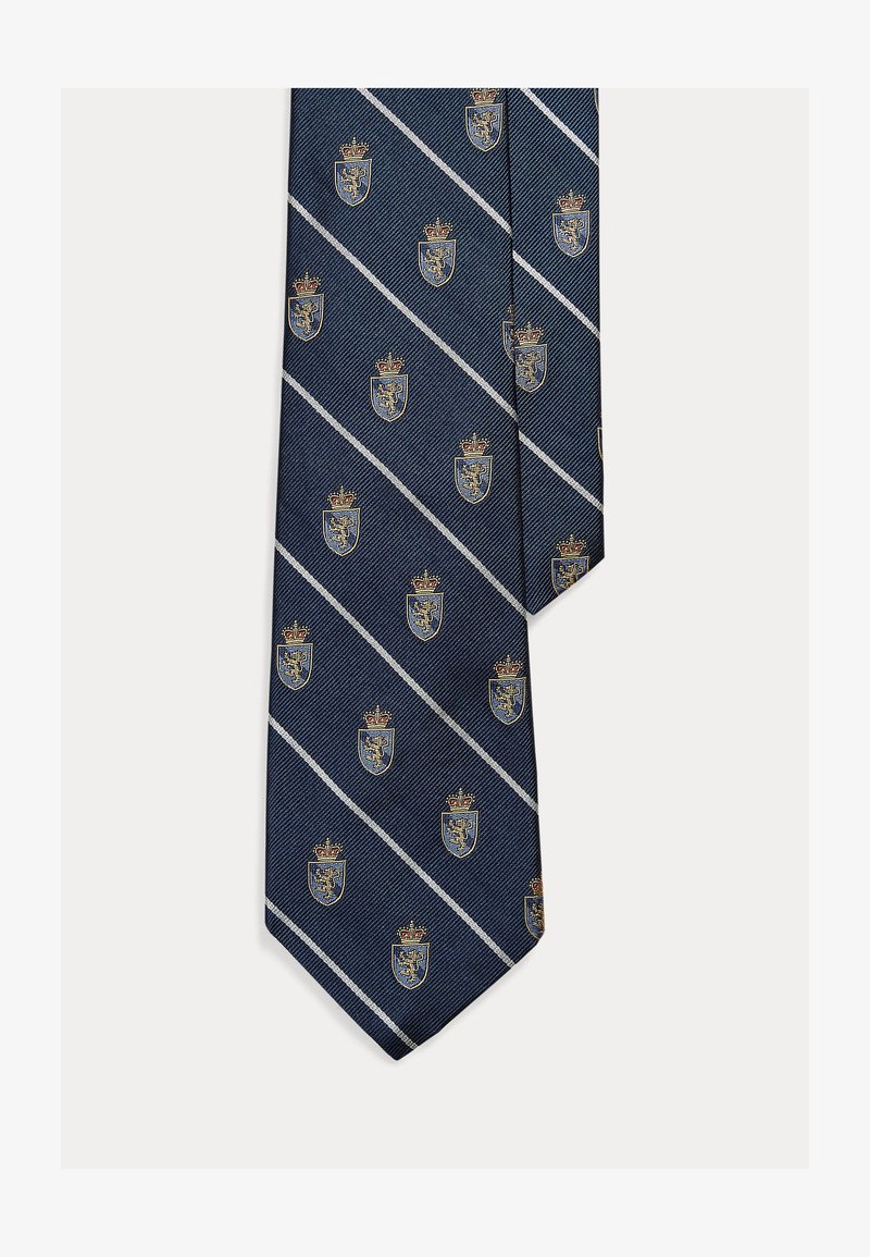 Gravata azul-marinho com padrão repetido de coroas e escudos em dourado e azul, com riscas diagonais brancas e tecido texturizado.