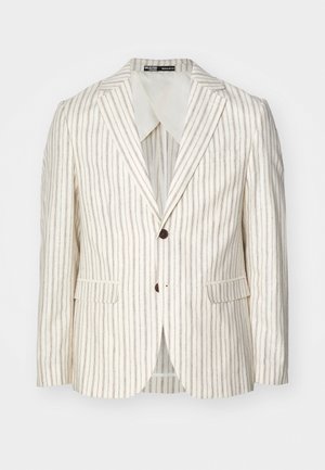 Gai bēšs žakets ar vertikālām brūnām svītrām, vienrindas dizains, ar iegrieztiem apmali, divām priekšējām kabatām un diviem pogām. Parasta piegriezuma.