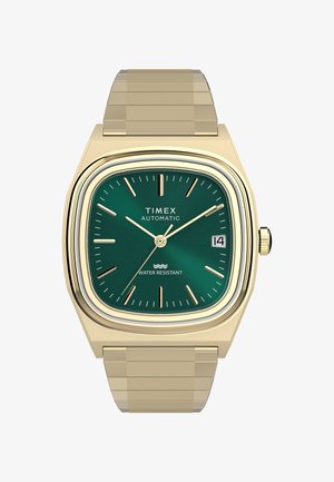 Auksinio tono Timex automatinis rankinis laikrodis su žaliu kvadratiniu ciferblatu, auksinėmis valandų žymėmis, datos langeliu ir atsparumu vandeniui.