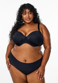 Black underwire bra with molded cups and adjustable straps, paired with matching high-waisted bikini bottoms. Smooth texture, minimalist design.