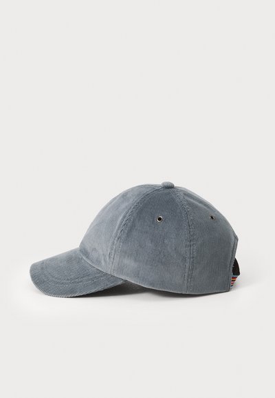 Grå corduroy baseball caps med en buet skjerm, en teksturert overflate, ventilasjonsøyer på toppen, og et flerfarget mønster som aksent bak.
