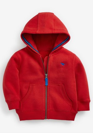 Rote Kinder-Sweatjacke mit Reißverschluss, blauem Innenfutter in der Kapuze, Vordertaschen, gerippten Bündchen und kleinem blauem, gesticktem Logo auf der Brust.