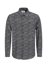 Camicia a maniche lunghe bianca e nera con un motivo geometrico, apertura con bottoni e colletto standard. Tessuto morbido.