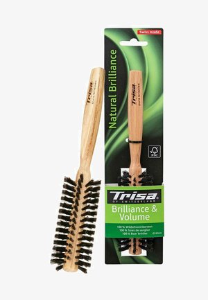 Spazzola rotonda in legno con setole nere di cinghiale, etichettata "Trisa Brilliance & Volume", esposta accanto al suo imballaggio commerciale verde e nero.