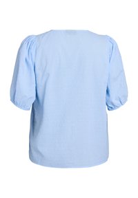 Blusa azzurro chiaro con maniche a sbuffo, scollo rotondo e tessuto a pois texturizzato, con una vestibilità ampia e orlo dritto nella parte inferiore.