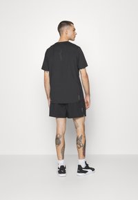 Puma RUN CLOUDSPUN - T-Shirt sport - puma black