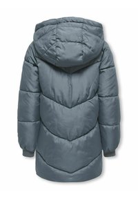 Szürke puffermellény kapucnival, chevron varrásmintával és rugalmas csuklókkal. Az anyag puha, sima tapintású.