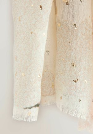 Kirjava silkkihuivi, jossa on kultaiset foliotäplät, fringed-reunat ja hienovarainen tekstuurikuvio. Kevyt kangas parantaa laskeutumista ja pehmeyttä.