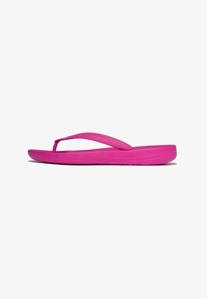 Bright pink flip-flop sandal with a thick sole and textured Y-shaped strap, shown in side profile on a white background.
