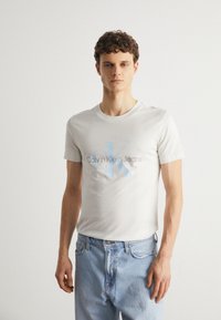 Calvin Klein Jeans SEASONAL MONOLOGO TEE - Marškinėliai su spaudiniu - ivory