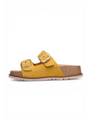 Sandalia de ante amarillo tipo slip-on con dos tiras ajustables con hebilla, plantilla de corcho y suela de goma color marrón claro.