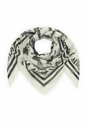 Foulard triangulaire de couleur claire avec motifs noirs de papillons et fleurs, bordure rayée, plié délicatement en forme circulaire.