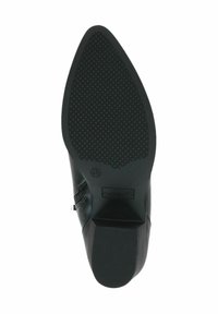 Suela de zapato de cuero negro con patrón de agarre texturizado, forma curva y detalle del logo. Construcción sólida con un talón ligeramente elevado.