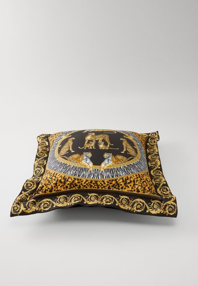 Decorative cushion featuring a bold animal print design with gold accents, black and orange colors, and intricate patterns along the edges.